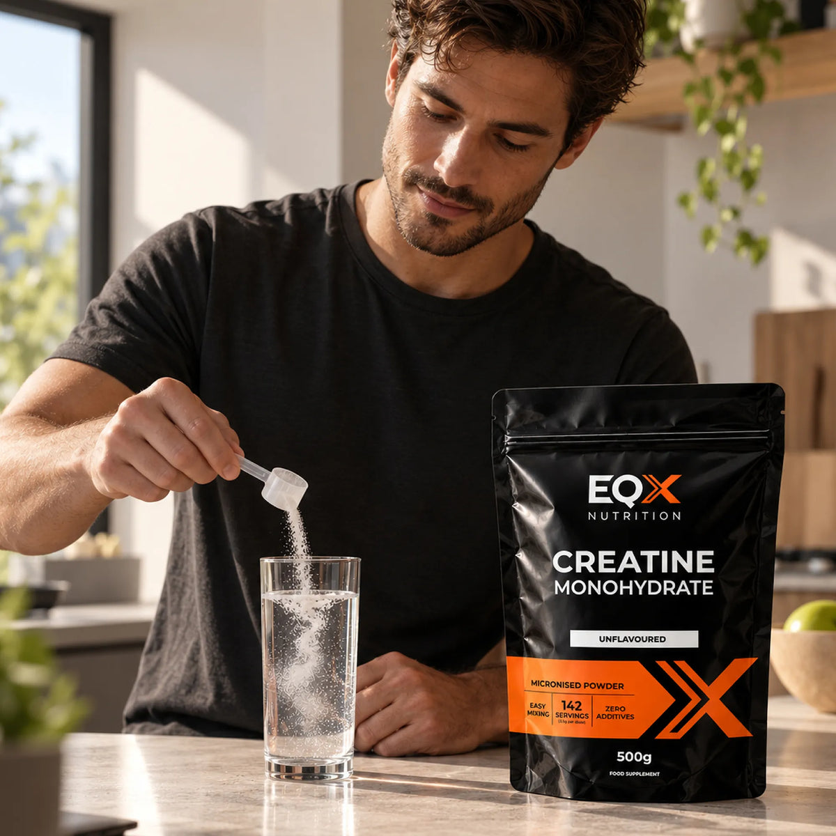 Man adding unflavoured EQX Creatine Monohydrate to a glass of water beside the 500 g pack.